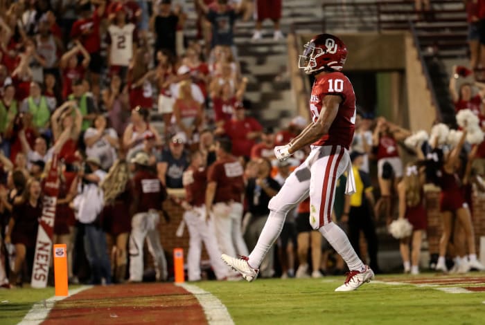 Sep 7, 2019; Norman, OK, USA; Oklahoma Sooners wide receiver Theo Wease (10) reacts after scoring a touchdown during the second half against the South Dakota Coyotes at Gaylord Family - Oklahoma Memorial Stadium. Credit: Kevin Jairaj-USA TODAY Sports